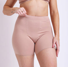 Load image into Gallery viewer, Size S woman wearing champagne organic cotton high rise boxer pulling on waistband (no-pinch, soft waistband) no side seams, lace detail