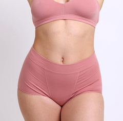 Load image into Gallery viewer, Size medium woman showing front view of certified organic cotton boyshort in rose color
