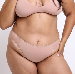 Load image into Gallery viewer, Size L model showing front view of Organic Cotton Black Champagne Mid Rise Brief
High cut sides, clean lace detail, breathable soft comfy cotton fabric