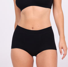 Load image into Gallery viewer, Size XS woman showing front view of comfortable organic cotton boyshort in Midnight Black
