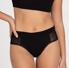Load image into Gallery viewer, Woman wearing small la coochie organic cotton high rise brief underwear style with mesh panels
