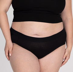 Load image into Gallery viewer, Front view of XXL woman wearing organic cotton high rise brief underwear in all-cotton black style
