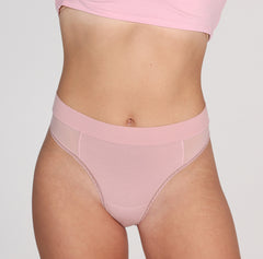 Load image into Gallery viewer, Front view of woman wearing blush pink organic cotton high waisted thong with mesh panels
