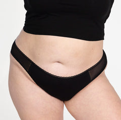 Load image into Gallery viewer, XXL woman front view wearing organic cotton mid rise underwear brief style in midnight black, featuring lace detail and mesh panels