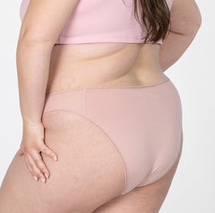 Load image into Gallery viewer, Back and butt view of XXL model wearing la coochie organic cotton mid rise brief underwear in blush pink style