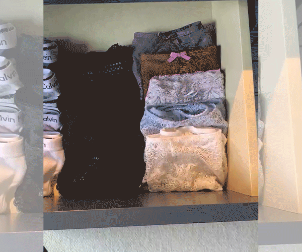 woman grabbing handful of old underwear out of drawer