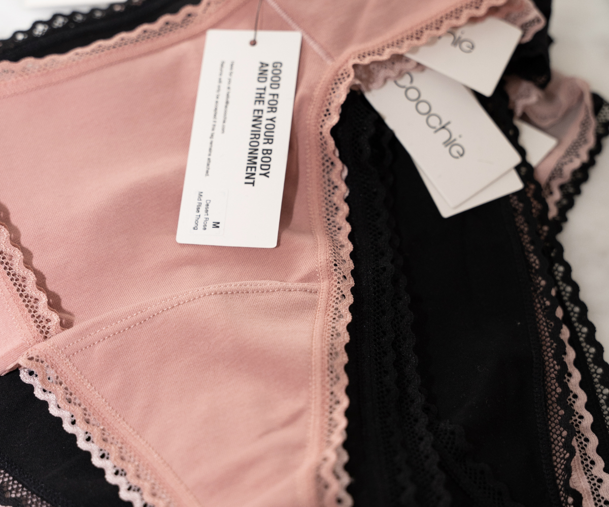 pile of organic cotton thongs in blush pink and midnight black