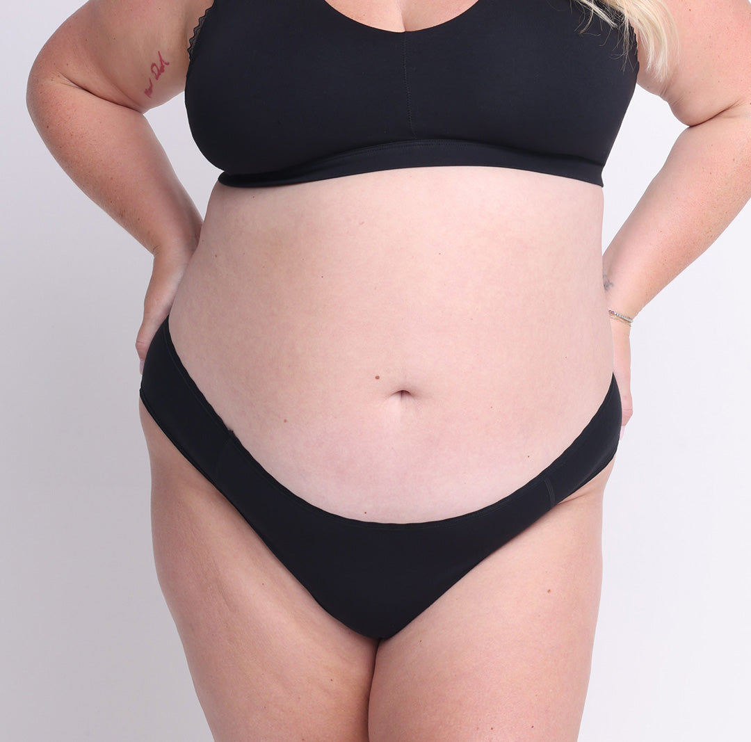 Size 2XL model showing front view of organic cotton mid rise cheeky brief in midnight black
Super soft, breathable cotton fabric with high cut sides and cheeky coverage