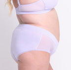 Size 2XL model showing back view of certified organic cotton high rise brief in lilac haze with mesh side panels
breathable, super soft cotton fabric with no side seams and cheeky coverage