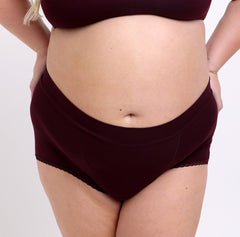 Load image into Gallery viewer, Size 2xl woman showing front view of certified organic cotton boyshort in black cherry color
