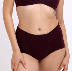 Load image into Gallery viewer, Size XS woman showing front view certified organic cotton boyshort in black cherry color
