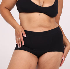 Load image into Gallery viewer, Size Large woman wearing certified organic cotton boyshort in midnight black
High Rise, no side seams, full coverage
