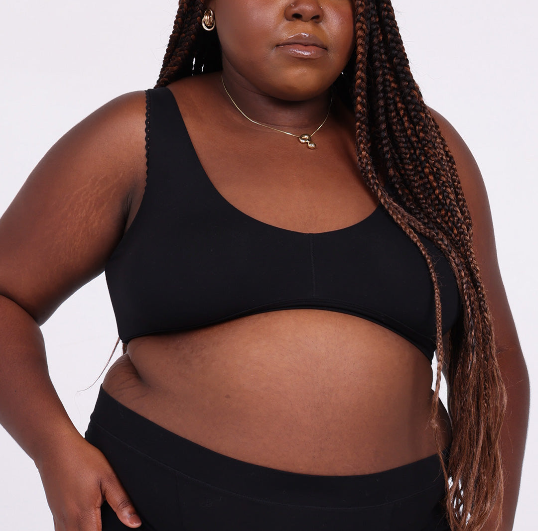 Size 2XL Woman showing front view of certified organic cotton fabric scoop bralette with no underwire 
