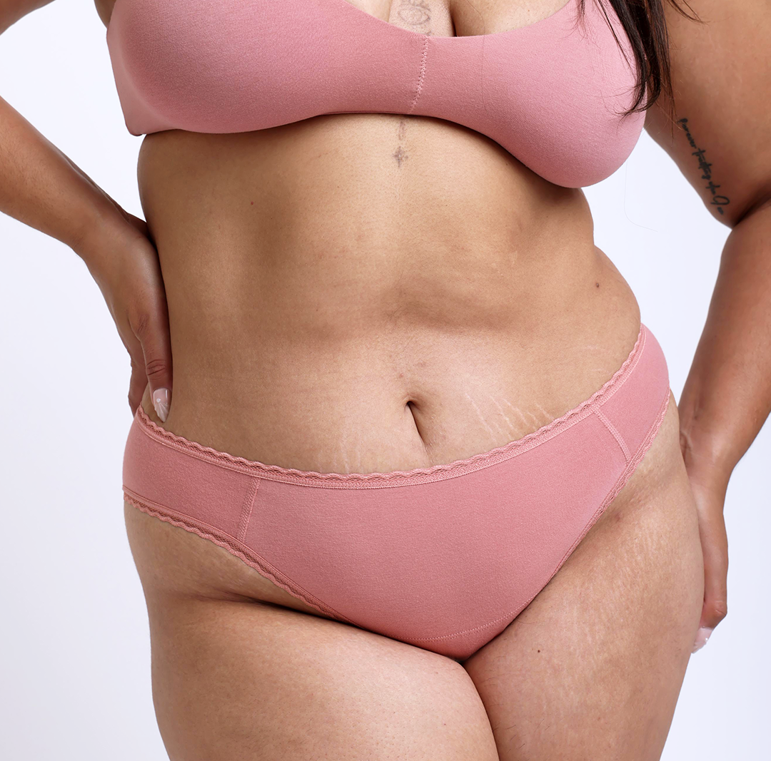 Size L Model showing front view of Organic Cotton Rose Mid Rise Brief 
Super soft, breathable cotton fabric with high cut sides and sewn down gusset