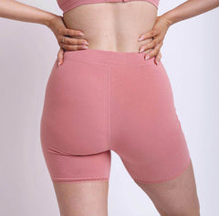 Load image into Gallery viewer, Size M woman showing back view of high rise organic cotton desert rose boxer. Full bum coverage, lace detail, no side seams. 
