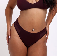 Load image into Gallery viewer, Woman wearing comfortable certified organic cotton underwear high rise thong black cherry
