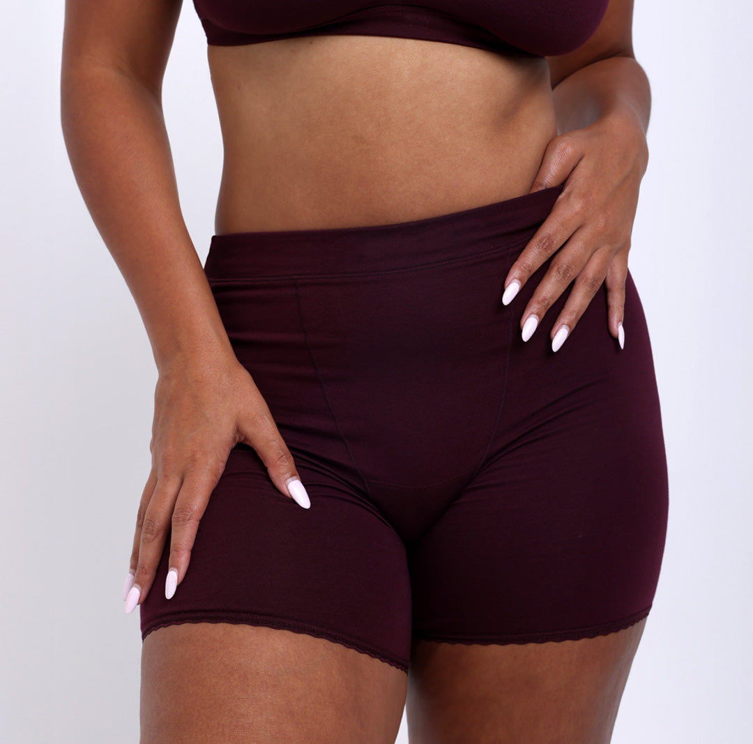 Size L Woman wearing high rise organic cotton boxer underwear in black cherry
Showing no pinch super soft waistband, longer inseam & anti-chafing fabric
