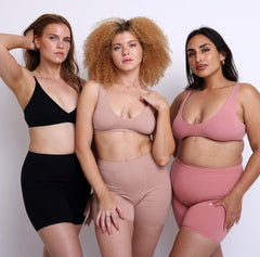 Load image into Gallery viewer, 3 Women (Size M, Size S, Size L) wearing breathable certified organic cotton high rise boxers in Black, champagne &amp; desert rose colors
