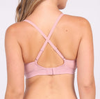 Size M woman showing back view of blush pink certified organic cotton triangle bralette with adjustable straps
