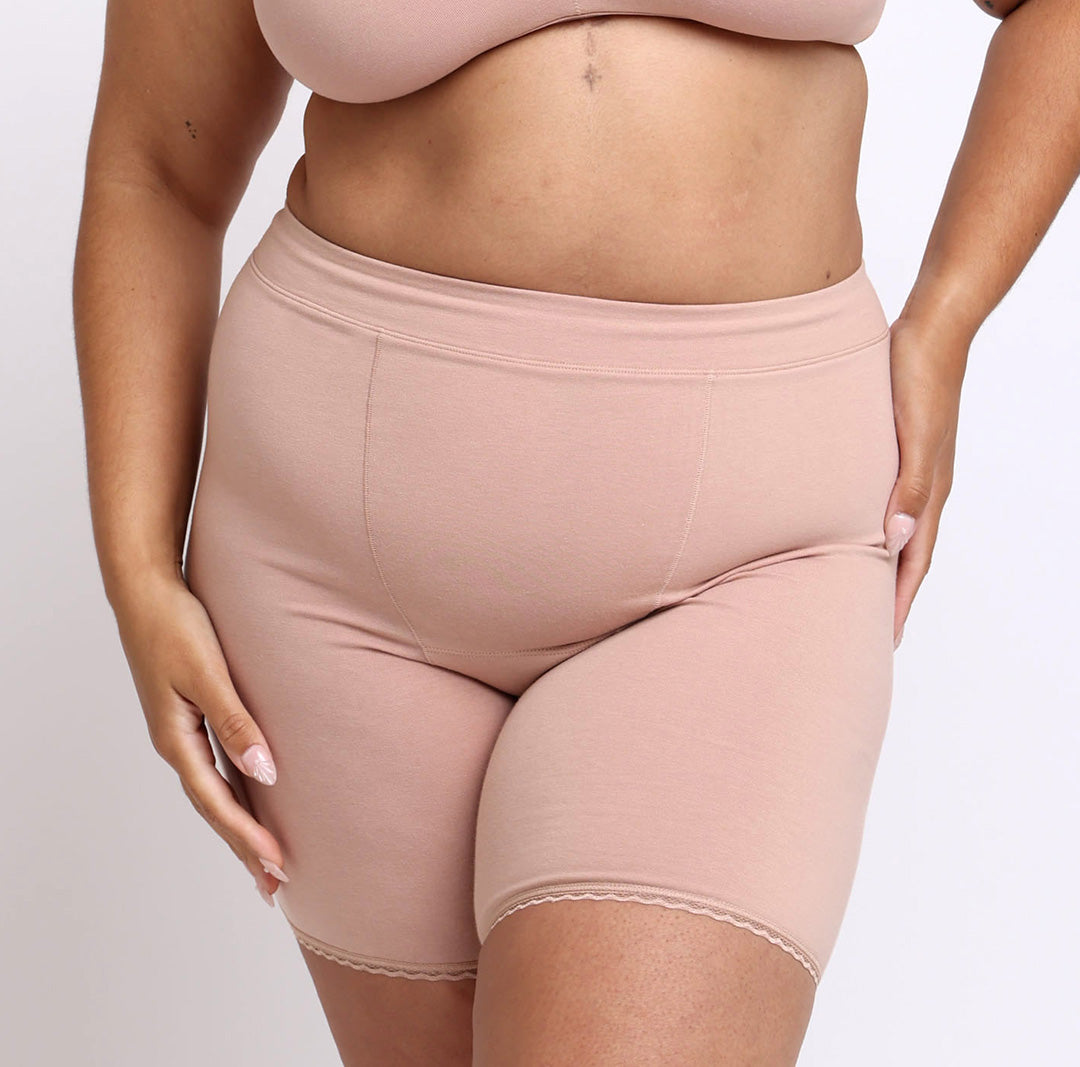 Size L Woman wearing high rise organic cotton boxer underwear in champagne
No pinch waistband, longer inseam, long sewn down gusset, no side seams