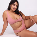 Size large Woman showing front view of certified organic cotton scoop neck bralette
