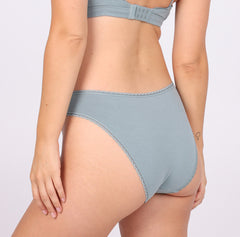 Load image into Gallery viewer, Size M model showing back view of Organic Cotton sage Mid Rise Brief with cheeky coverage
Soft, breathable &amp; comfy cotton fabric
