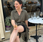Woman laughing wearing black organic cotton boxer under dress for security and anti cahfe