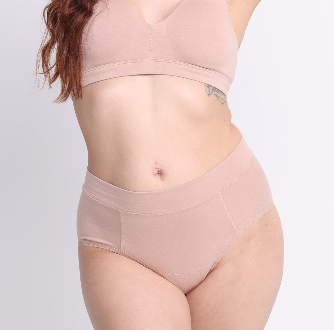 Size XS model showing front view of certified organic cotton high rise brief in champagne
breathable, super soft cotton fabric with no side seams and cheeky coverage