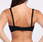 Size X-small Woman showing back view of certified organic cotton bralette with lace detail and adjustable closure and straps
