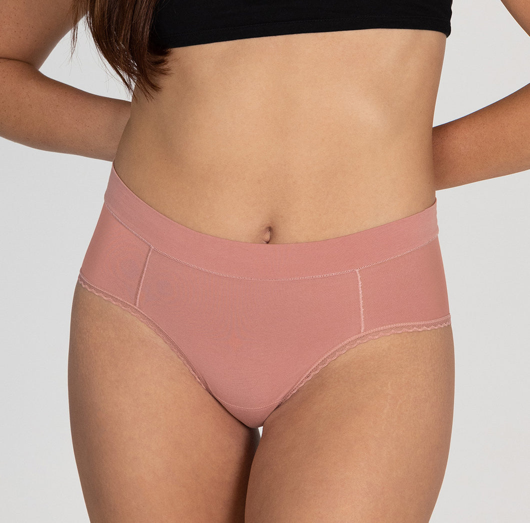 Front view of size small woman wearing organic cotton high rise brief underwear style in desert rose pink color