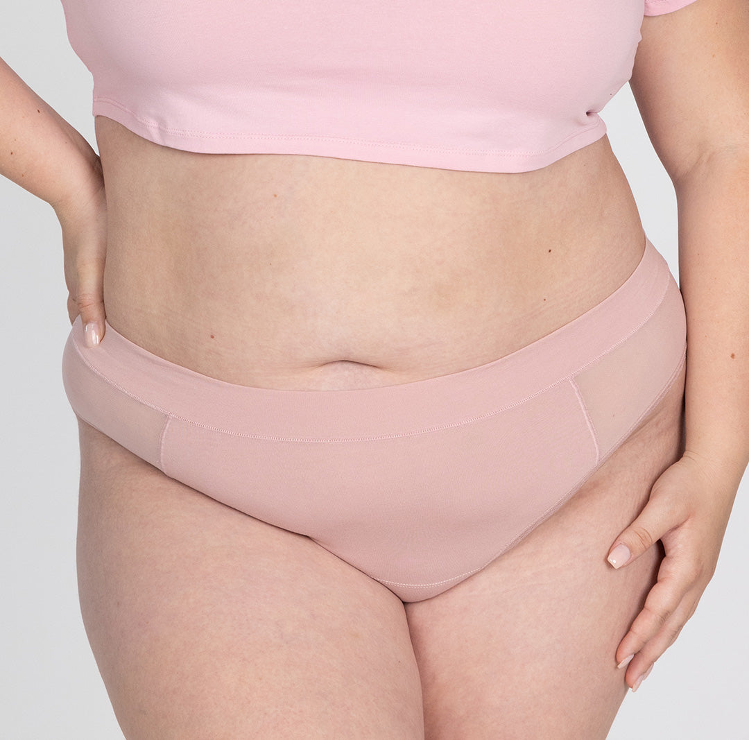 XXL woman front view wearing blush pink organic cotton high waisted thong underwear in blush pink